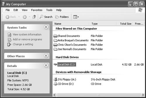 The My Computer window is the starting point for any folder-digging you want to do. It shows the “top-level” folders: the disk drives of your PC. If you double-click the icon of a removable-disk drive (such as your CD-ROM drive, Zip drive, or Jaz drive), you receive only an error message unless there’s actually a disk in the drive.