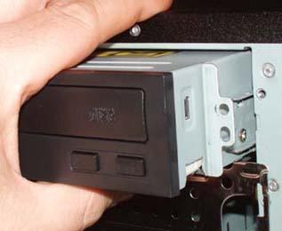 Slide the optical drive into the drive bay