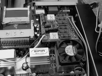 An iTuner power board mounted neatly on an EPIA motherboard