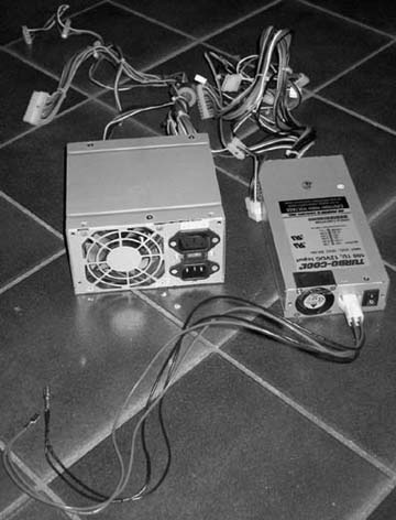 The original 220V and new 12V ATX power supplies