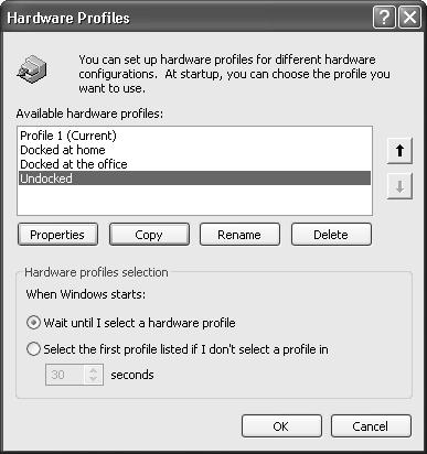 Every computer is equipped with a hardware profile named Profile 1. Creating a new profile is simply a matter of copying the existing profile, creating a new name for the copy, and making changes to it. Use the option buttons at the bottom to specify how long you want Windows to display the menu of profiles at system startup time.