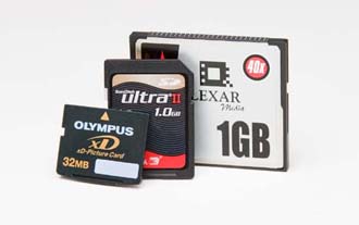 The tiny Secure Digital card (middle) is gaining popularity because you can use it in both your digicam and palmtop. The even tinier XD-Picture Card (left) works only with Fuji and Olympus cameras. The larger CompactFlash card is still the most common (especially in larger cameras).