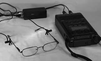 A set of binaural microphones on glasses, attached to a Marantz 660