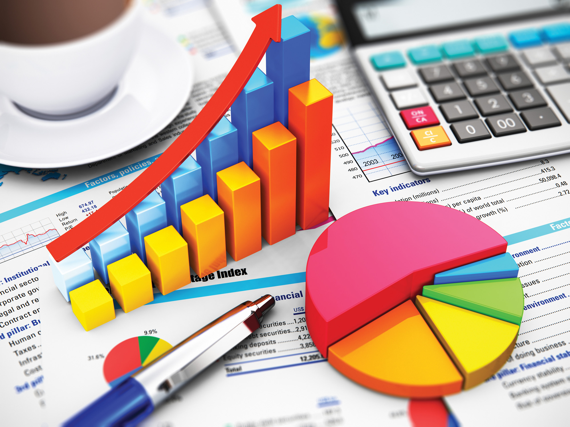 A colorful montage of financial reports, on top of which are positioned: a calculator, pie chart with multicolored slices, pen, double bar chart, and a cup of coffee.