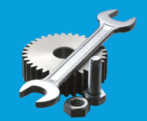 A photo of a gear, wrench, and nut and bolt set.