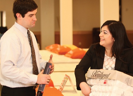 A photo shows Edith Botello with a salesperson in a store.