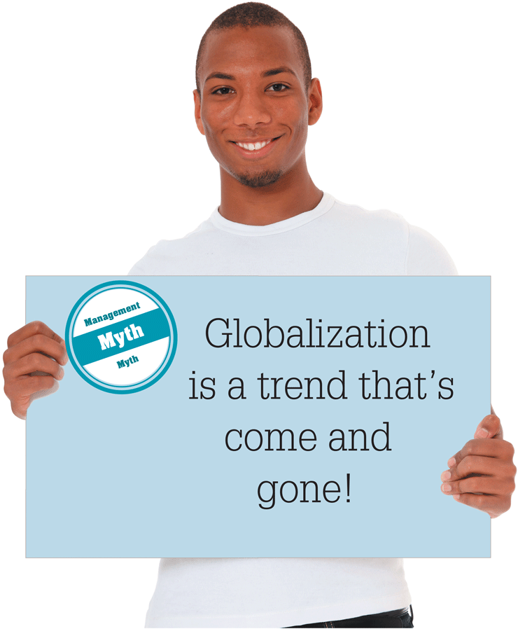 A photo shows a person holding up a board with the words, Globalization is a trend that’s come and gone!