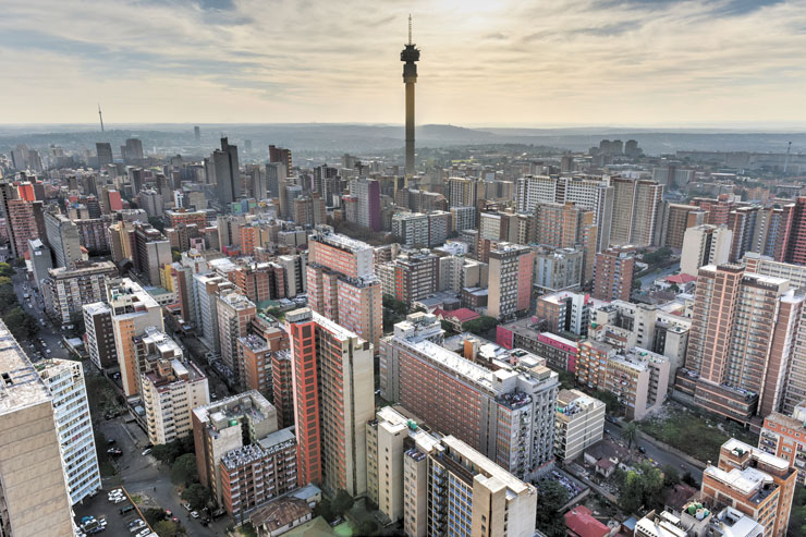 A photo shows an aerial view of a city with numerous high-rise buildings.