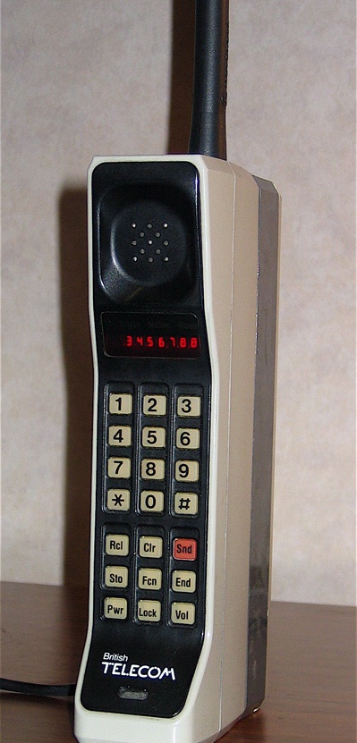 The Motorola DynaTAC 8000X was the first mobile phone to receive FCC acceptance, in 1983; DynaTAC was actually an abbreviation of Dynamic Adaptive Total Area Coverage