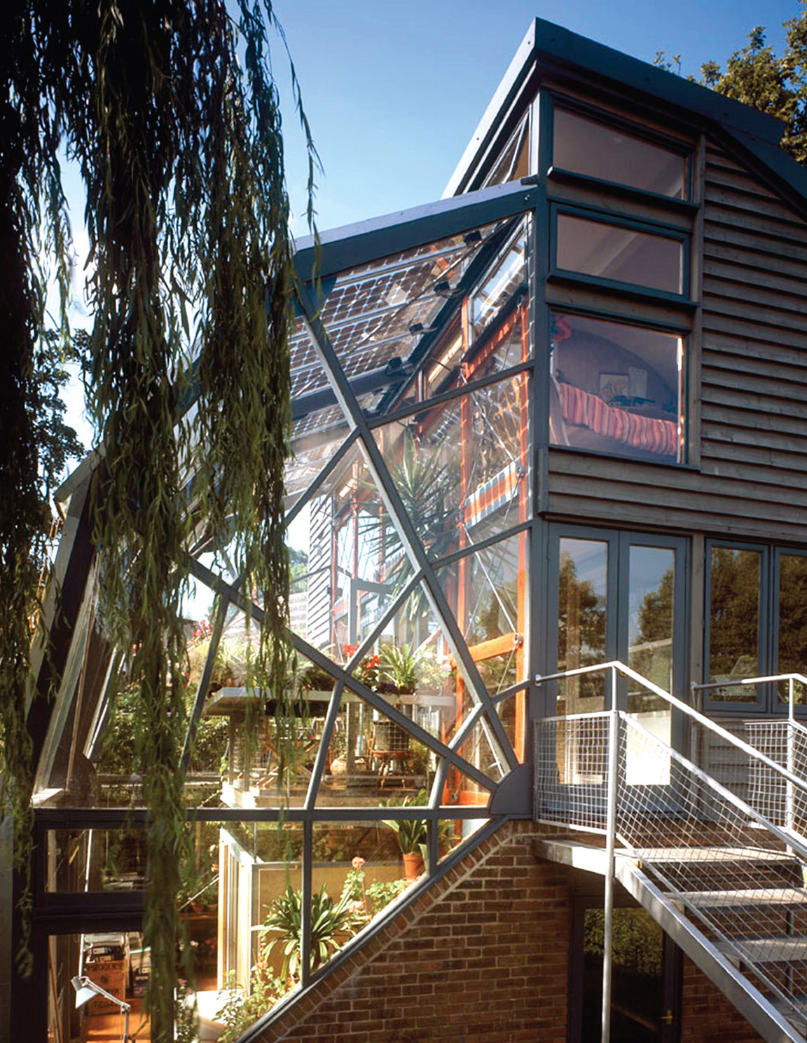 2.1 Hope House, the first experimental ‘ZED’ (1995). An automated pellet boiler for domestic hot water in winter, evacuated tube solar thermal collectors providing all hot water from late spring to early autumn and a 1.1 kW peak photovoltaic array.