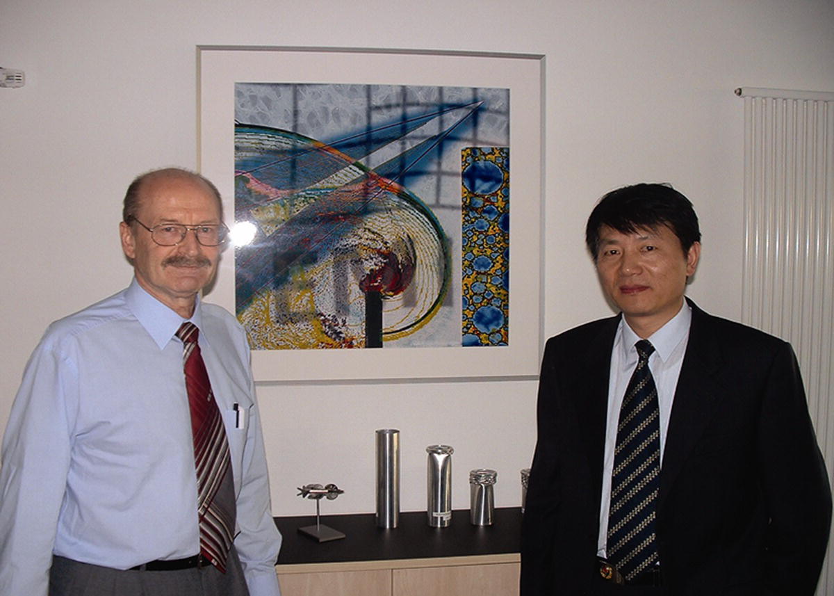 Photo of Professor Xiaoting Rui (right) standing beside Professor Klaus Thoma (left).