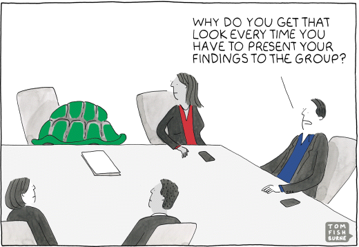 A cartoon image depicting a meeting room, where the boss is asking to one of the employee: “why do you get that look every time you have to present your findings to the group?”