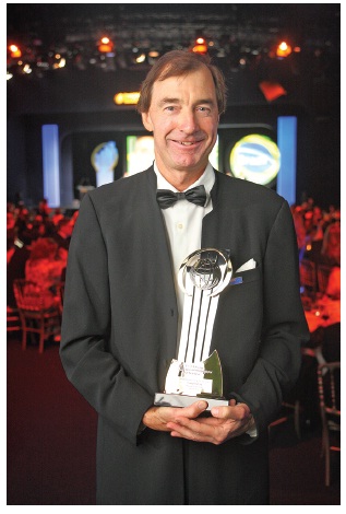Picture of “Craig Heatley, Founder of Rainbow Corporation And Sky Tv, New Zealand, holding the EY Entrepreneur of the Year 2012 trophy.” 