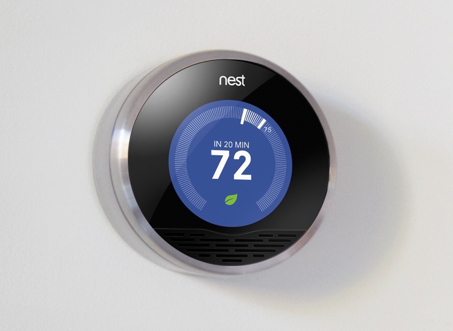 The Nest Learning Thermostat uses proximity sensors to know when someone walks into the room, then lights up and shows the temperature in a way that’s visible at a glance from across the room. No touching required. (Courtesy of Nest.)