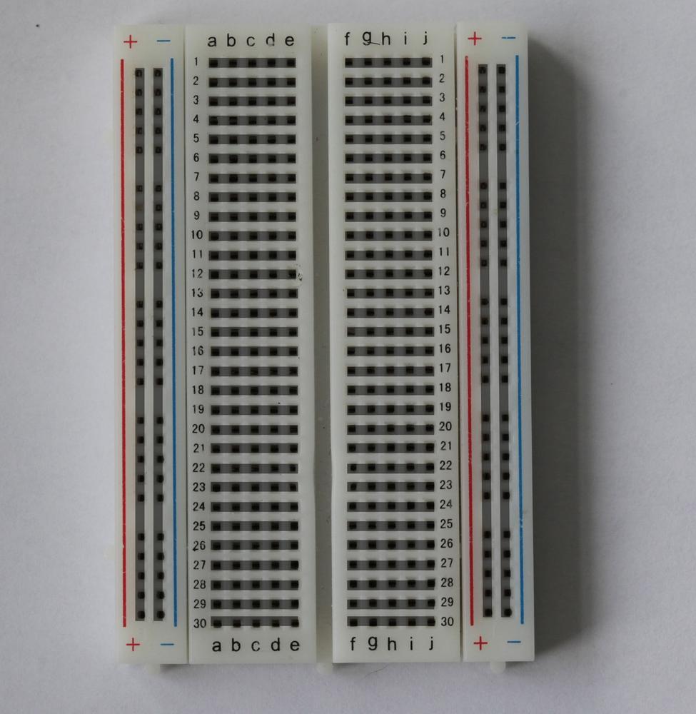 Electrical connections are already made between the shaded holes on this solderless breadboard. You’ll use jumper wires to connect them to each other and to your Galileo.