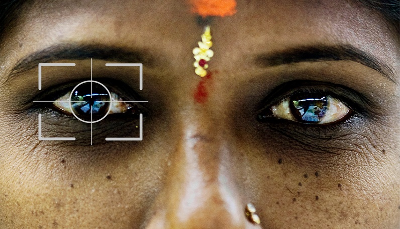 Unique Identification Authority of India (UIDAI) is running the Aadhaar project, whose goal is to provide a unique 12-digit identification number plus biometric data to authenticate to every one of the roughly 1.2 billion people in India. This is the largest scale ever reached by a biometric system. (Figure based on image by Christian Als/Panos Pictures.)