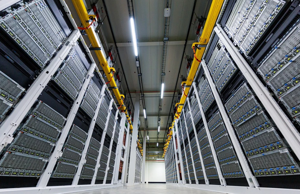 Inside a Microsoft datacenter, rows of server racks are lined up, showcasing the infrastructure supporting Azure's cloud services.