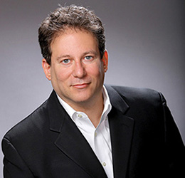 A photograph of the author Richard Knaster.