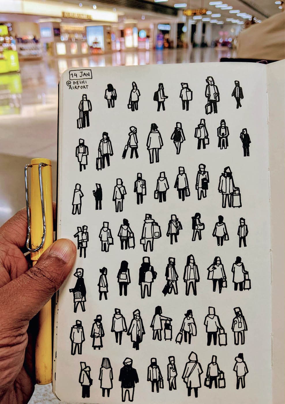 A sketch notebook depicts a page full of small contour sketches of people captured in a variety of candid poses at the Delhi airport.