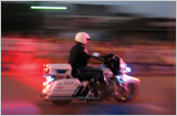 Panning the camera while shooting provides a fairly sharp photo of the main subject while it streaks the background (1/6 second, f/2.6, ISO 400).