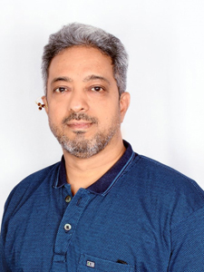 A grayscale upper body portrait of Shailesh Deshpande in casual attire.