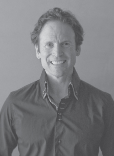 Photograph of Aaron Ross, is a keynote speaker and entrepreneur, is the author of the best-selling book Predictable Revenue, based on sales and outbound prospecting systems.