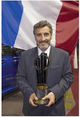 Picture of “Mohed Altrad, The Altrad Group, France, holding the EY World Entrepreneur of the Year 2015 trophy.”
