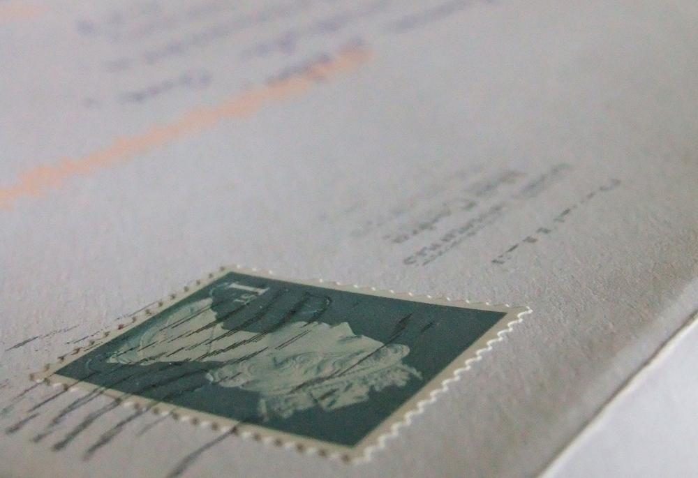 Envelope with stamp, address, and postmark