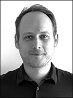 A black and white portrait photo of the author, Peter Kaiser.