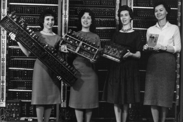 From Left to right: Patsy Simmers, Mrs. Gail Taylor, Mrs. Milly Beck and Mrs. Norma Stec, holding the ENIAC and newer versions of computer boards.
