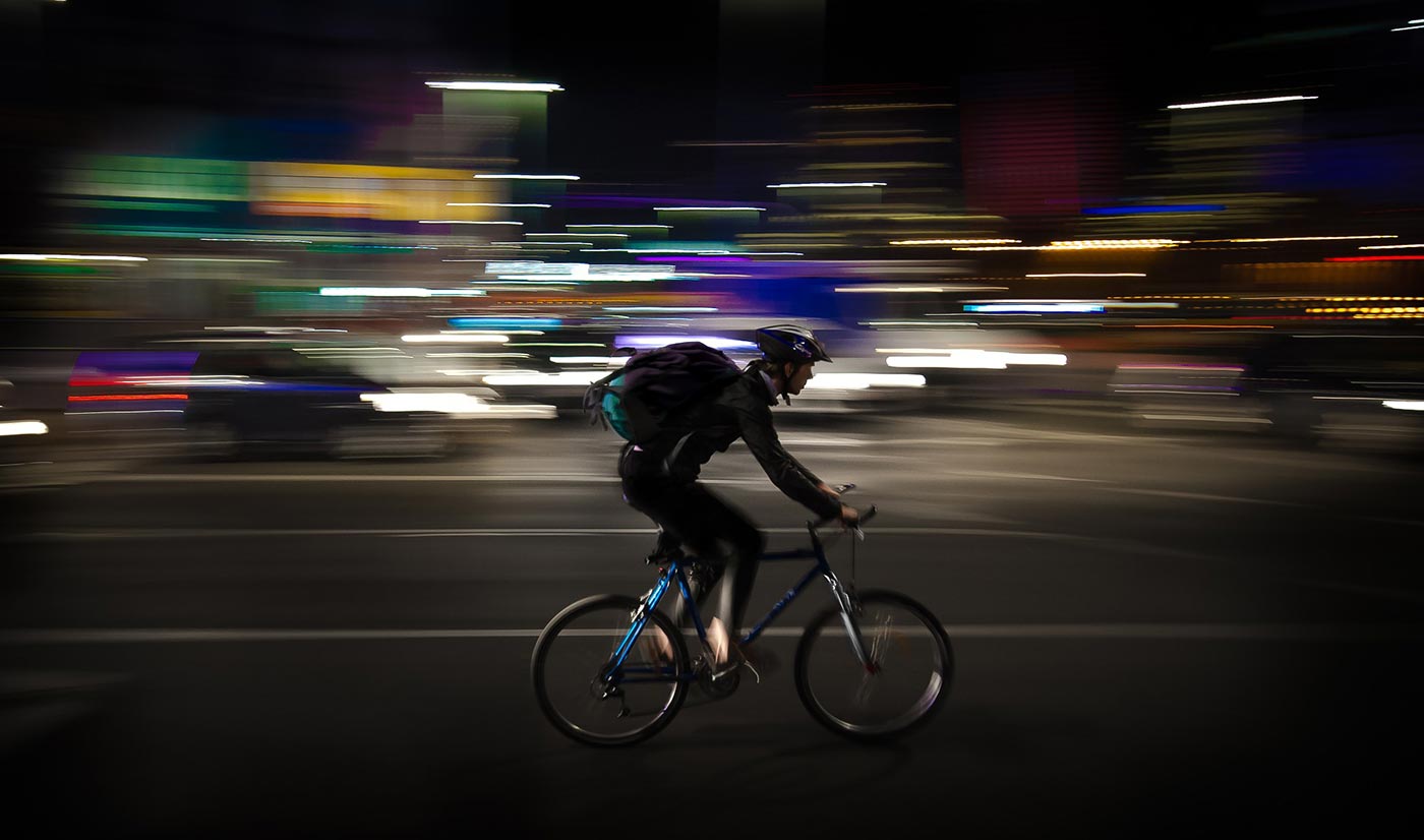 Bike courier at night