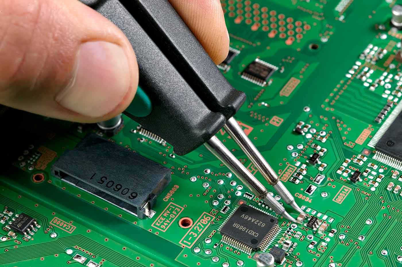 Soldering of a 1210 capacitor using no flux.