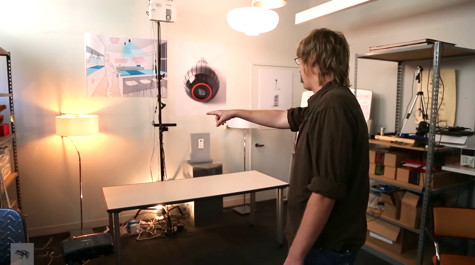 Jared Ficklin demonstrates Room-E, a system combining voice and gestural interactions; a gesture (pointing at a lamp) is combined with voice input (“computer, turn off this light”) to turn off the correct lamp.