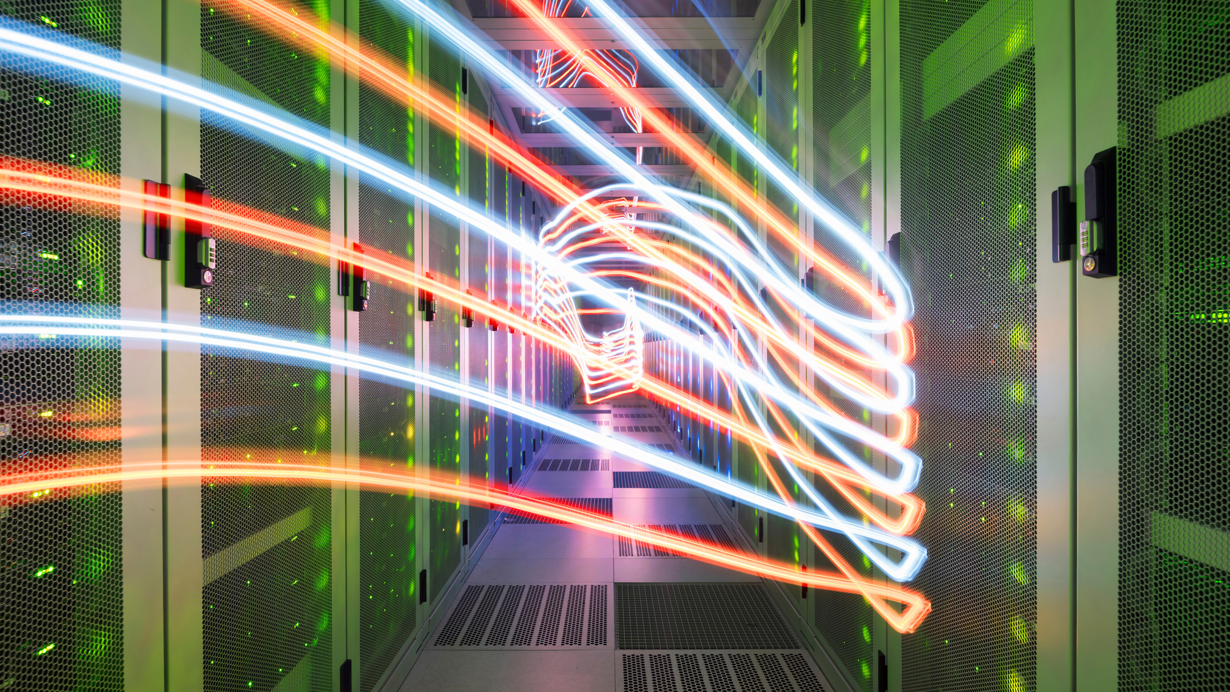 Colorful network waves traveling in server room of data center