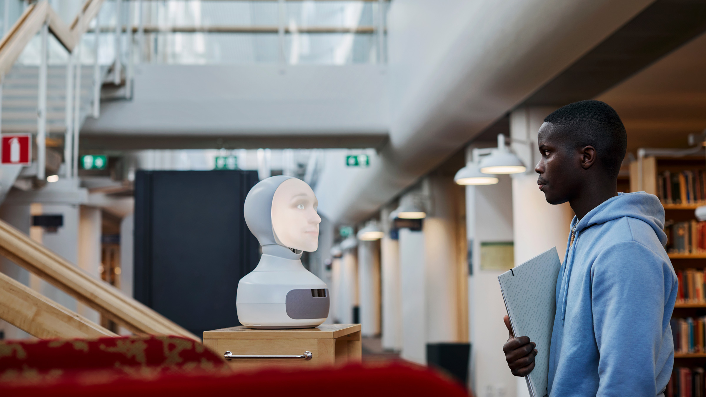 Student using voice assistant in library